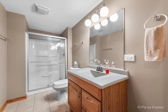 1122 Souders Ave, Elburn, IL 60119 - bathroom with vanity, toilet, a shower stall, tile patterned floors, and baseboards