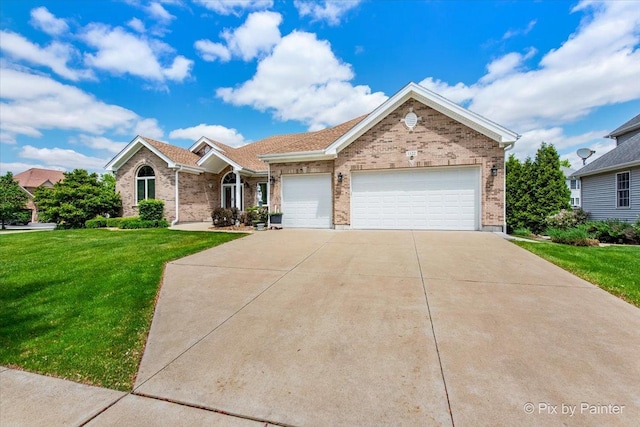 1122 Souders Ave, Elburn, IL 60119 - view of front of property featuring a front lawn, brick siding, an attached garage, and concrete driveway