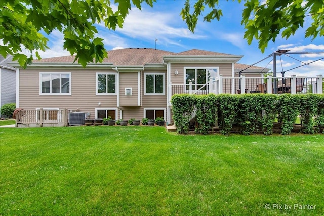 1122 Souders Ave, Elburn, IL 60119 - back of property featuring a lawn, central air condition unit, a wooden deck, and a shingled roof