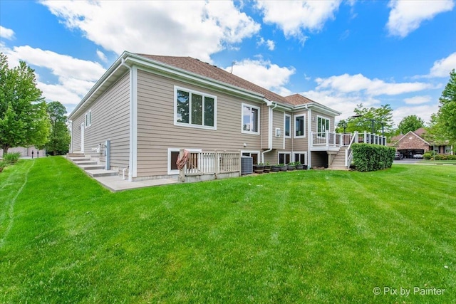 1122 Souders Ave, Elburn, IL 60119 - rear view of house featuring a yard, central AC unit, a deck, and stairway