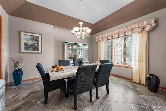 1122 Souders Ave, Elburn, IL 60119 - dining room featuring a chandelier, baseboards, lofted ceiling, and light tile patterned floors