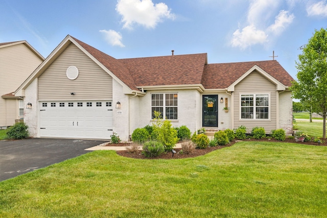4783 W Iris Ln, Monee, IL 60449 - traditional home with a shingled roof, driveway, a front yard, a garage, and brick siding
