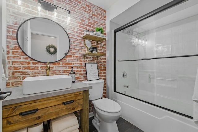 4783 W Iris Ln, Monee, IL 60449 - full bath featuring brick wall, vanity, toilet, and enclosed tub / shower combo