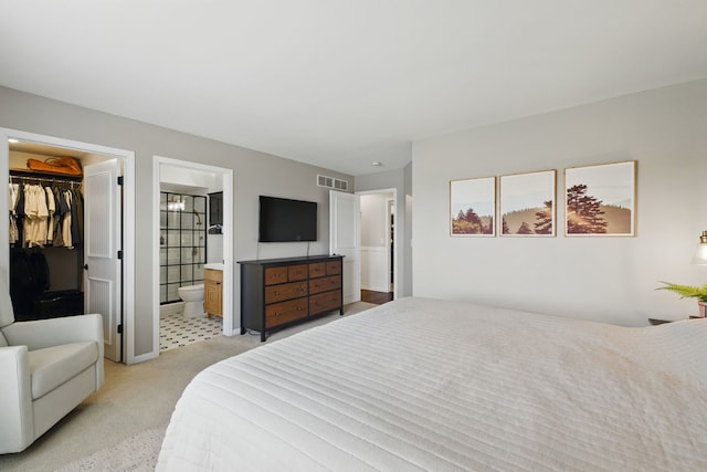 4783 W Iris Ln, Monee, IL 60449 - bedroom featuring light carpet, a spacious closet, ensuite bath, baseboards, and a closet