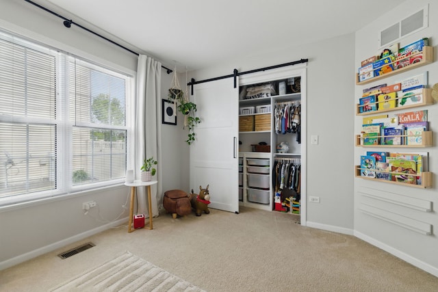 4783 W Iris Ln, Monee, IL 60449 - playroom featuring carpet floors, baseboards, and a barn door