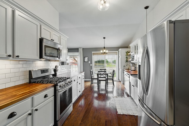 4783 W Iris Ln, Monee, IL 60449 - kitchen featuring stainless steel appliances, butcher block countertops, a chandelier, dark wood finished floors, and backsplash