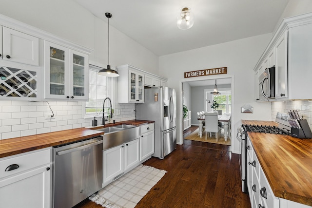 4783 W Iris Ln, Monee, IL 60449 - kitchen with wooden counters, appliances with stainless steel finishes, a sink, dark wood-style flooring, and glass insert cabinets