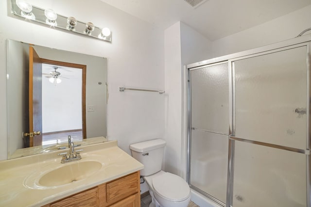 14603 Maple Ln, Dolton, IL 60419 - full bathroom featuring a stall shower, toilet, vanity, and ceiling fan
