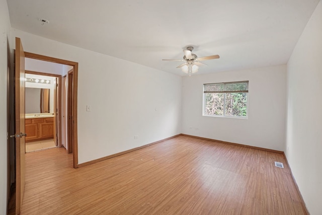 14603 Maple Ln, Dolton, IL 60419 - unfurnished room with light wood finished floors, ceiling fan, baseboards, and a pendent fire sprinkler