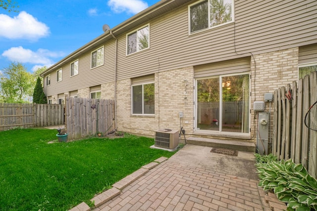 14603 Maple Ln, Dolton, IL 60419 - rear view of house with brick siding, a patio, and cooling unit