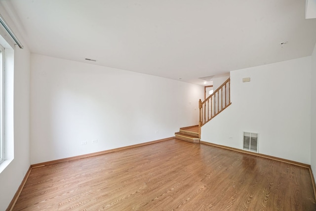 14603 Maple Ln, Dolton, IL 60419 - unfurnished room featuring wood finished floors, stairs, and baseboards