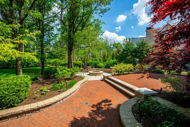 view of home's community with a fire pit