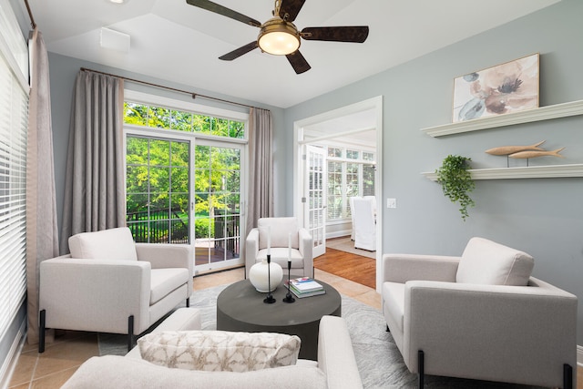 living area with a ceiling fan