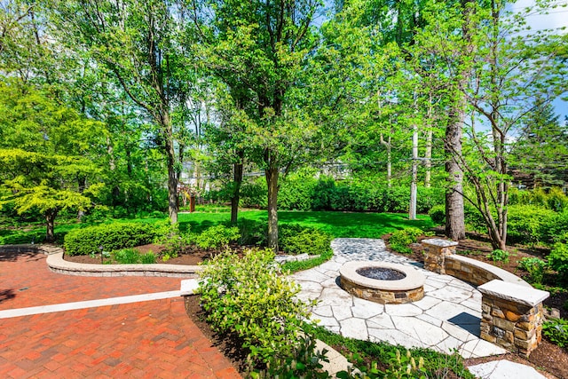 view of patio / terrace featuring an outdoor fire pit