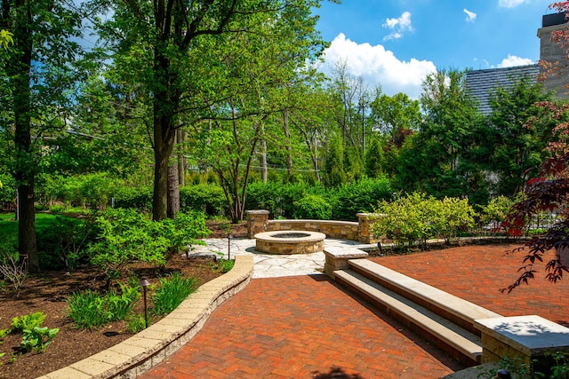 view of patio with an outdoor fire pit