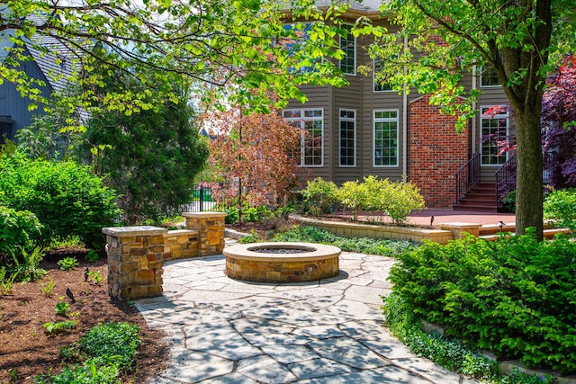 view of patio / terrace with an outdoor fire pit