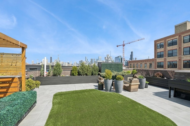 1156 W Ohio St Unit 4E, Chicago, IL 60642 - view of green lawn with a view of skyline and a patio