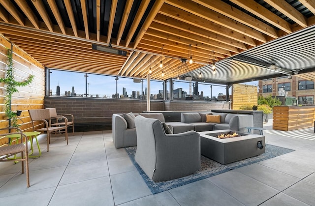1156 W Ohio St Unit 4E, Chicago, IL 60642 - view of patio / terrace with a view of skyline and an outdoor living space with a fire pit