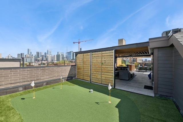 1156 W Ohio St Unit 4E, Chicago, IL 60642 - view of community featuring a putting area, a patio area, a view of skyline, and fence