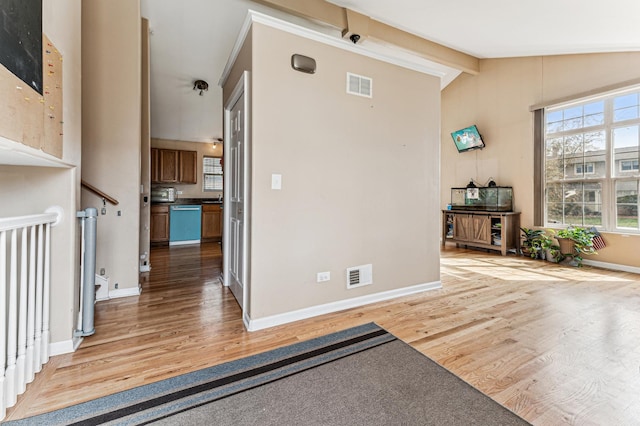 entryway featuring light wood finished floors and baseboards