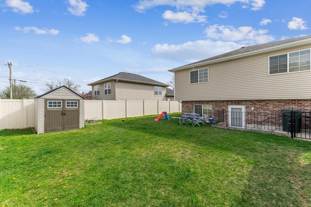 view of yard featuring a storage unit and an outdoor structure