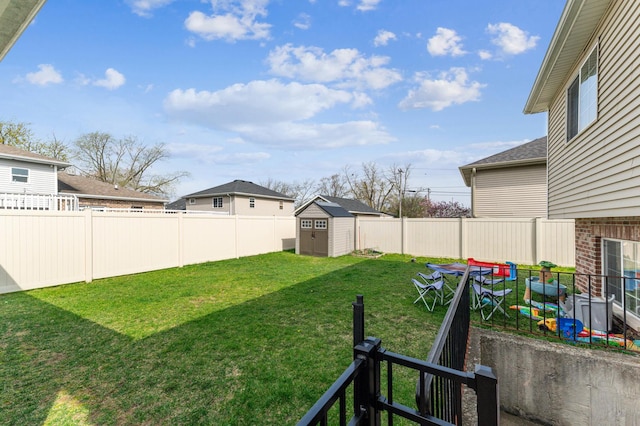 view of yard featuring a storage shed and an outbuilding