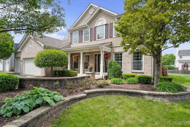 1514 Somerfield Dr, Bolingbrook, IL 60440 - traditional home with brick siding, a porch, and a garage