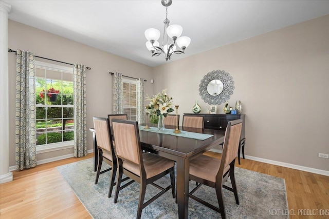 1514 Somerfield Dr, Bolingbrook, IL 60440 - dining area with a chandelier, light wood finished floors, and baseboards