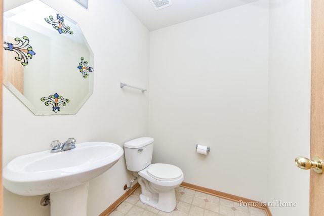 8408 Coop Ave, Joliet, IL 60431 - bathroom featuring toilet and baseboards