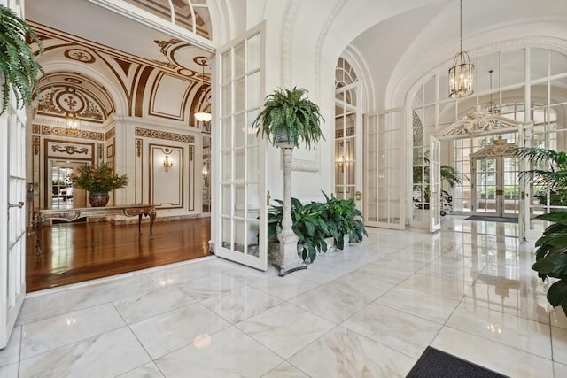building lobby featuring high vaulted ceiling