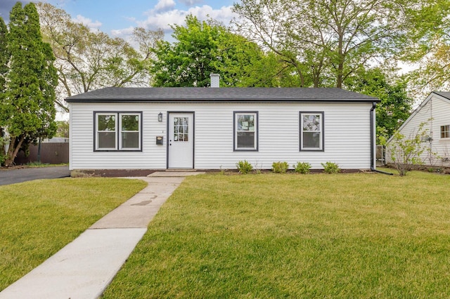 519 Everette Ave, Romeoville, IL 60446 - single story home featuring a front lawn, a chimney, and roof with shingles