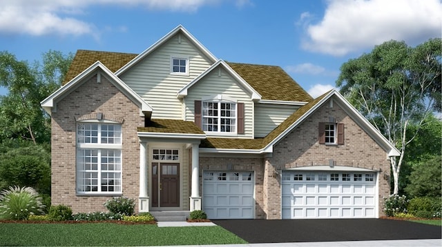 traditional-style house with asphalt driveway and brick siding