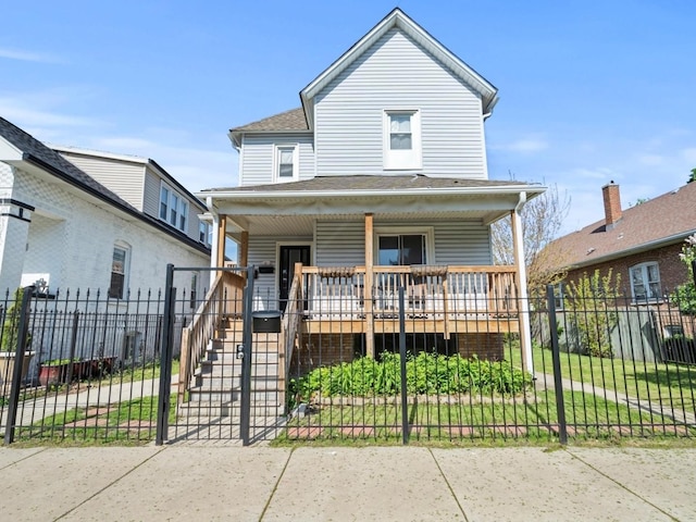 6508 S Albany Ave, Chicago, IL 60629 - view of front facade with a porch, a fenced front yard, and stairway
