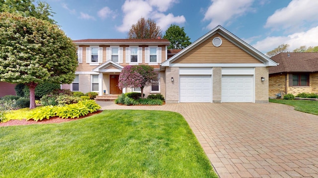 2030 N Oak Wood Dr, Arlington Heights, IL 60004 - view of front of property with decorative driveway, a garage, a front lawn, and brick siding