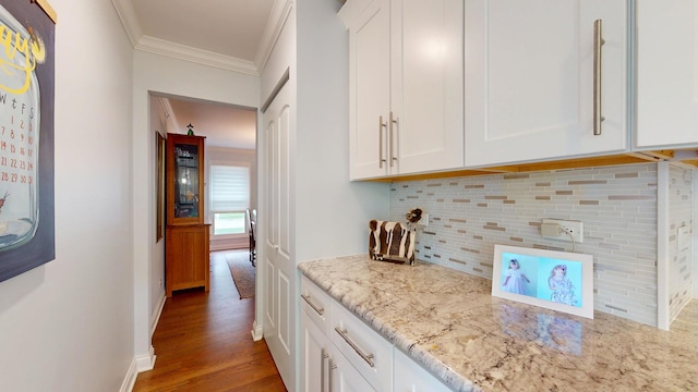 2030 N Oak Wood Dr, Arlington Heights, IL 60004 - kitchen with decorative backsplash, ornamental molding, white cabinetry, light stone countertops, and wood finished floors