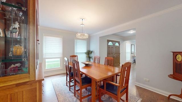 2030 N Oak Wood Dr, Arlington Heights, IL 60004 - dining space with wood finished floors, baseboards, ornamental molding, and a chandelier