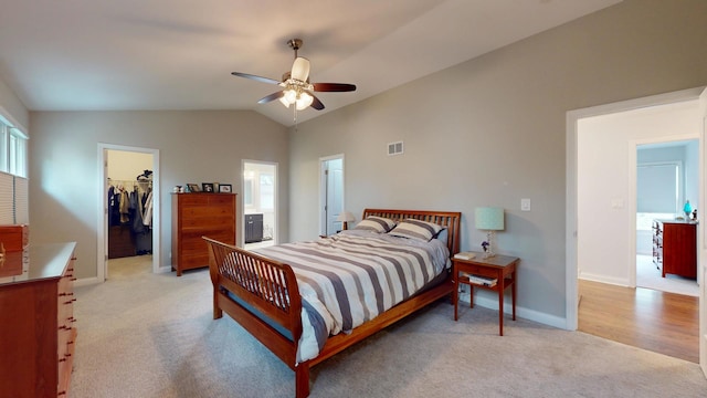 2030 N Oak Wood Dr, Arlington Heights, IL 60004 - bedroom featuring light colored carpet, a walk in closet, baseboards, a closet, and vaulted ceiling