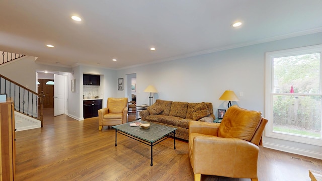 2030 N Oak Wood Dr, Arlington Heights, IL 60004 - living room with stairs, wood finished floors, crown molding, healthy amount of natural light, and recessed lighting