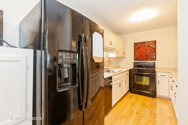 2211 S Highland Ave Unit 4B, Lombard, IL 60148 - kitchen featuring black dishwasher, white cabinets, light countertops, backsplash, and light wood-style flooring