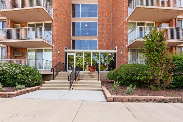 2211 S Highland Ave Unit 4B, Lombard, IL 60148 - hall featuring wood finished floors, a textured ceiling, and carpet floors