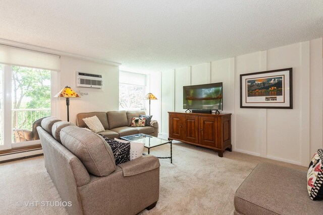 2211 S Highland Ave Unit 4B, Lombard, IL 60148 - living room featuring light carpet, a decorative wall, a wall mounted AC, and a textured ceiling