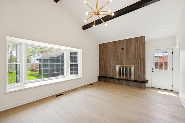 1929 S Ashland Ave, Park Ridge, IL 60068 - unfurnished living room with beam ceiling, a chandelier, high vaulted ceiling, a fireplace, and healthy amount of natural light