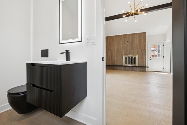 1929 S Ashland Ave, Park Ridge, IL 60068 - bathroom featuring wood finished floors, vanity, toilet, and a chandelier