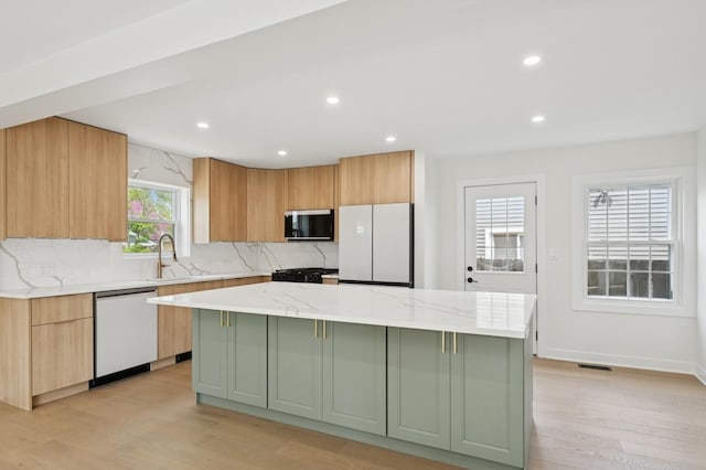 1929 S Ashland Ave, Park Ridge, IL 60068 - kitchen with white appliances, a sink, a kitchen island, tasteful backsplash, and recessed lighting