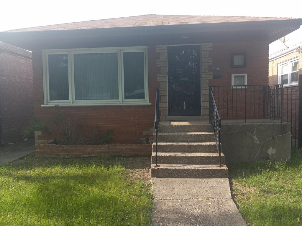 2320 E 103rd St, Chicago, IL 60617 - view of front of home with brick siding and covered porch