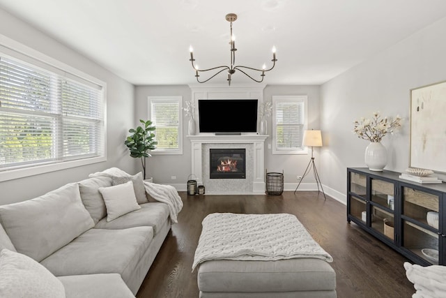 15175 Rodao Ln, Orland Park, IL 60467 - living area featuring a chandelier, plenty of natural light, baseboards, and a glass covered fireplace