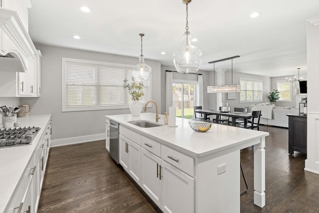 15175 Rodao Ln, Orland Park, IL 60467 - kitchen with a sink, stainless steel appliances, recessed lighting, baseboards, and a kitchen breakfast bar