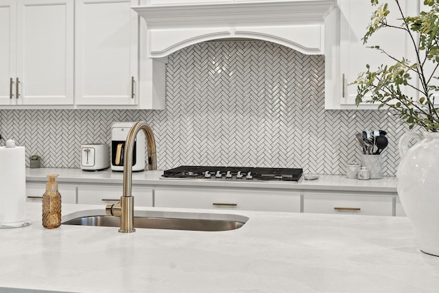 15175 Rodao Ln, Orland Park, IL 60467 - kitchen featuring a sink, light countertops, white cabinetry, and backsplash