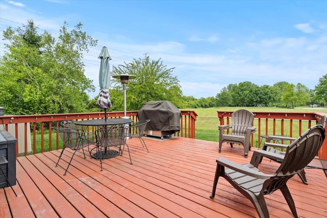 638 E Princeton Ct, Round Lake Beach, IL 60073 - wooden terrace with area for grilling, outdoor dining space, and a lawn