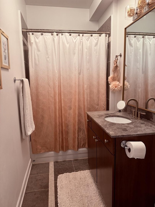 4722 N Beacon St Unit 1E, Chicago, IL 60640 - bathroom featuring vanity, tile patterned floors, shower / bathtub combination with curtain, and baseboards